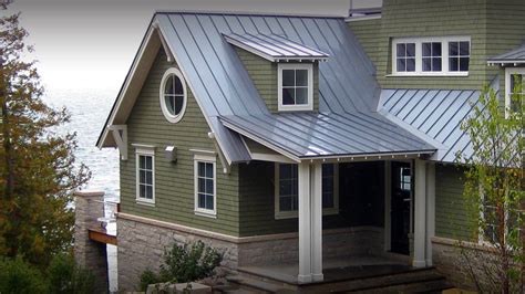 metal roof on green sided craftsman house|light green metal roof reviews.